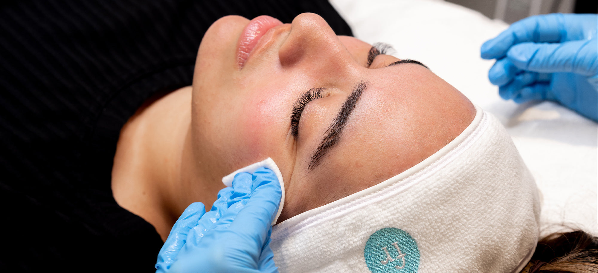 provider wiping patient's face