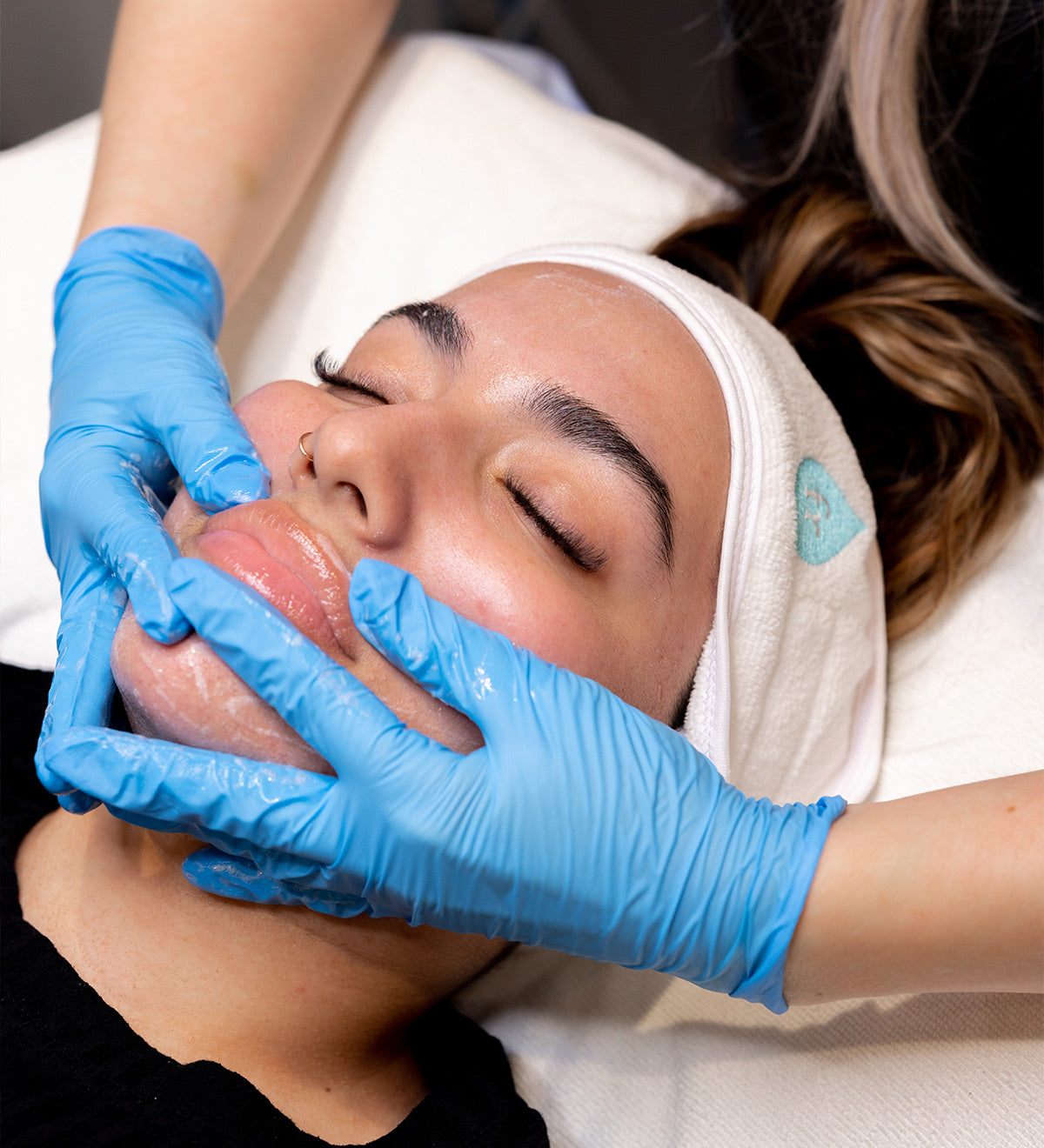 Woman receiving a facial massage