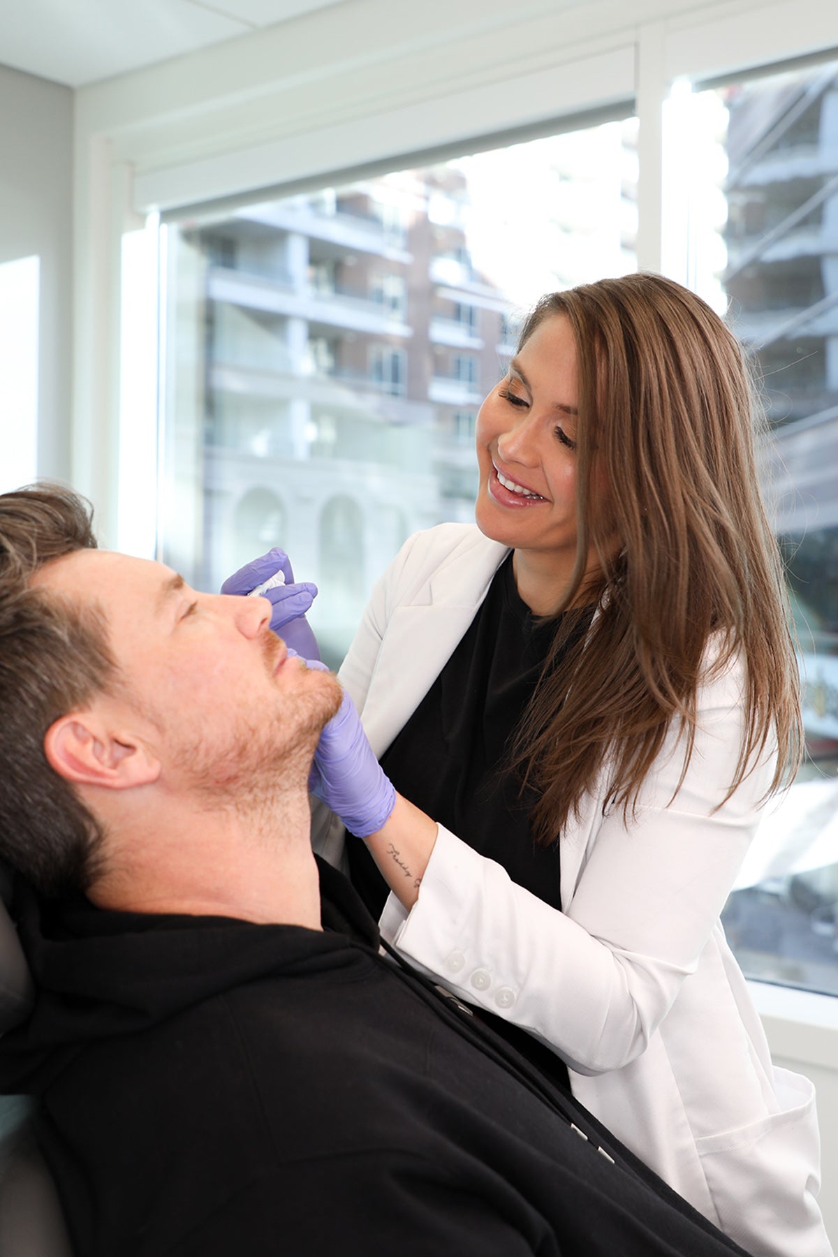 Man receiving an injection from Nurse Megan