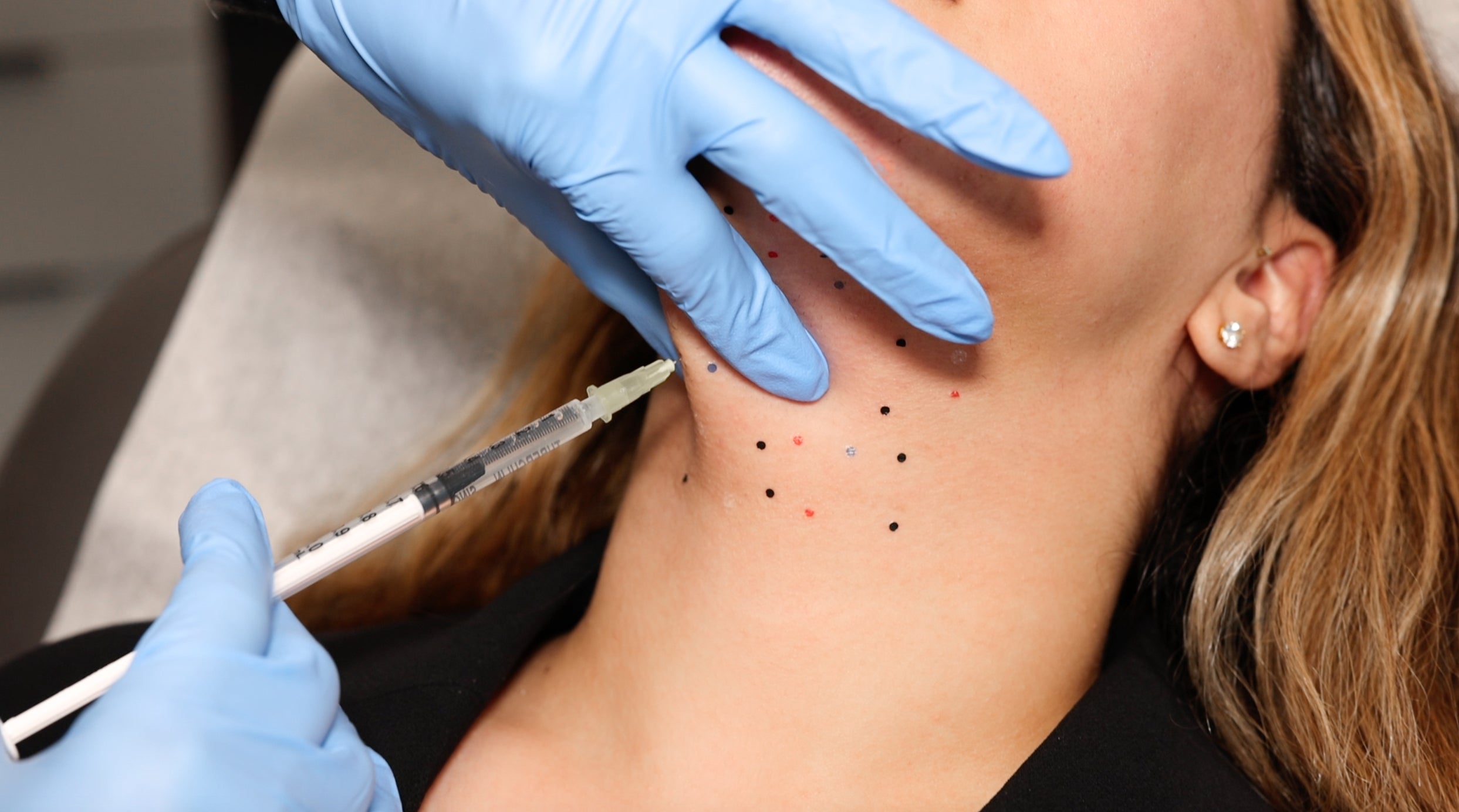 woman receiving treatment on neck