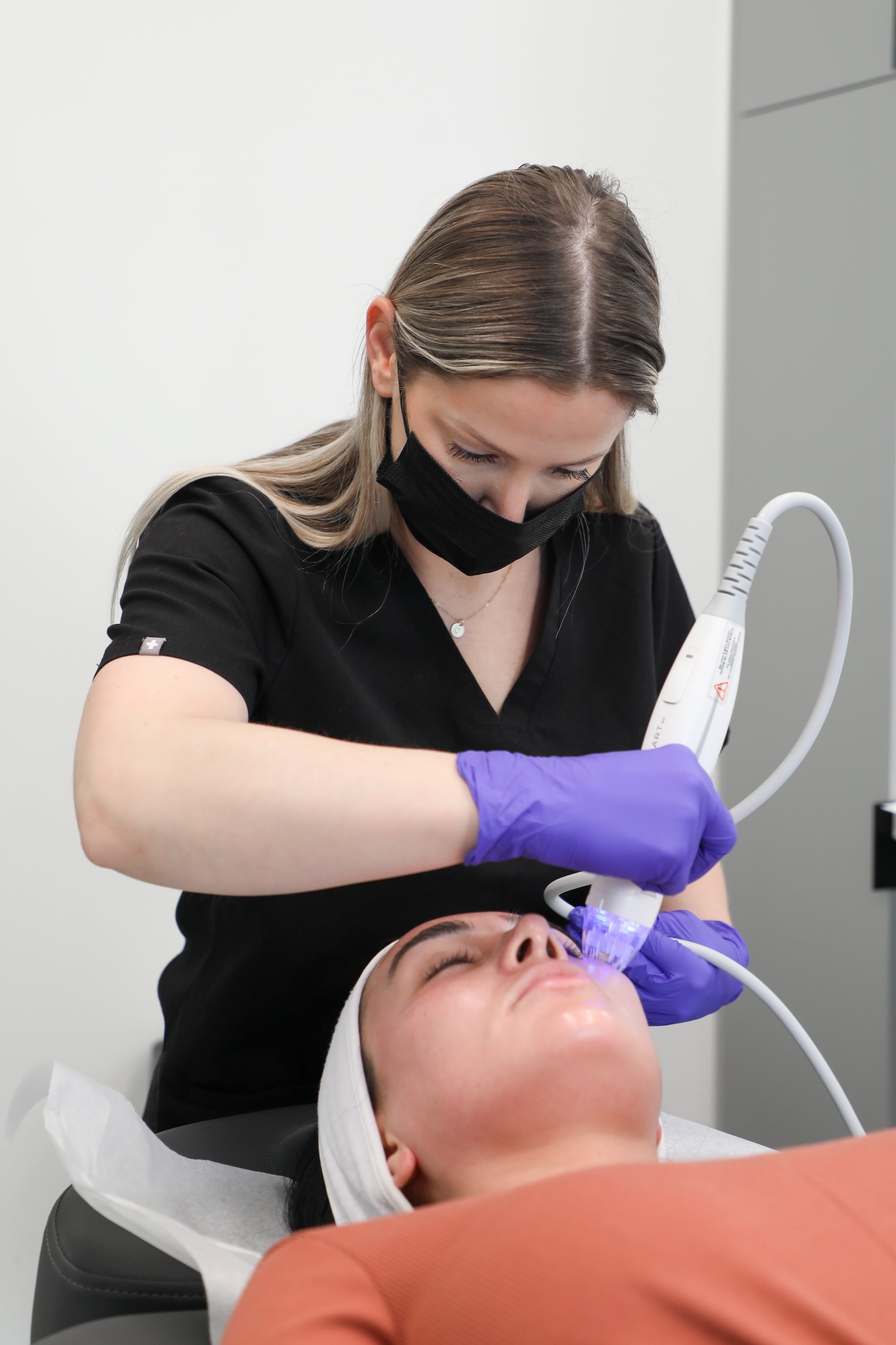 provider doing microneedling on patient