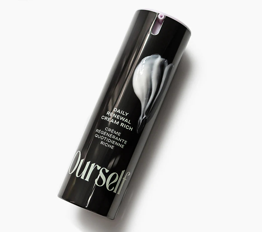 Cosmetic bottle labeled 'Ourself' with 'Daily Renewal Cream Rich' on a white background