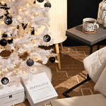 Epicutis holiday boxes under a white Christmas tree