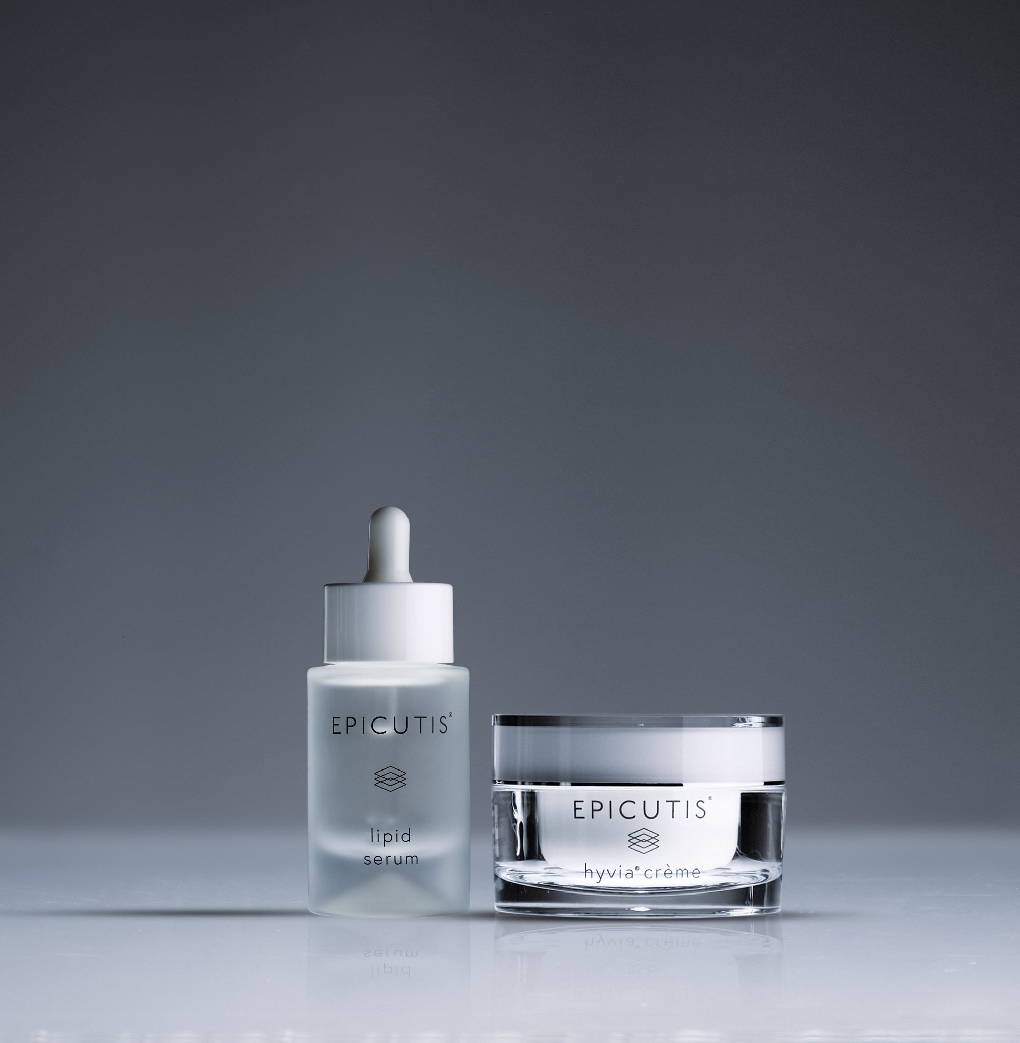 Epicutis Luxury Skincare Set, Lipid Serum and Hyvia Crème on gray background