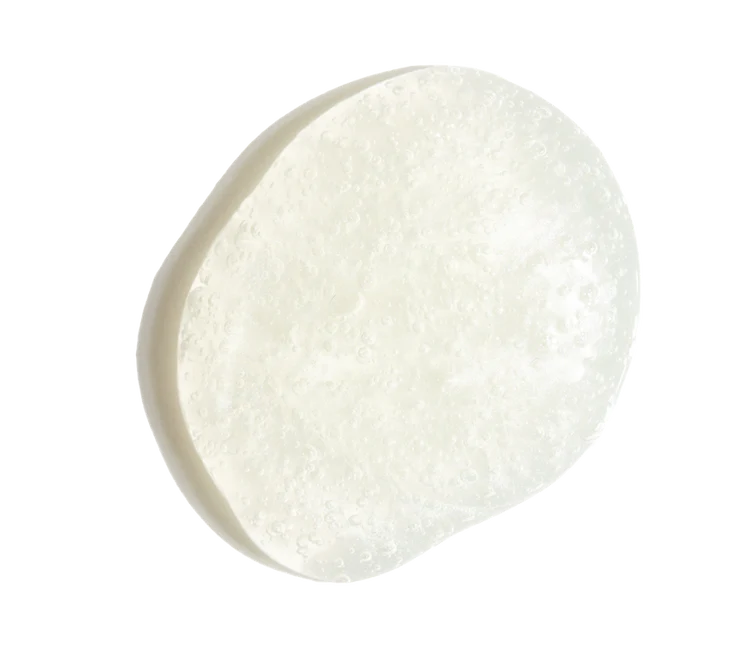 A single irregularly shaped, translucent off-white drop of Ourself Daily Purifying Cleanser