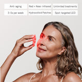 Omnilux Skin Corrector, model using the device
