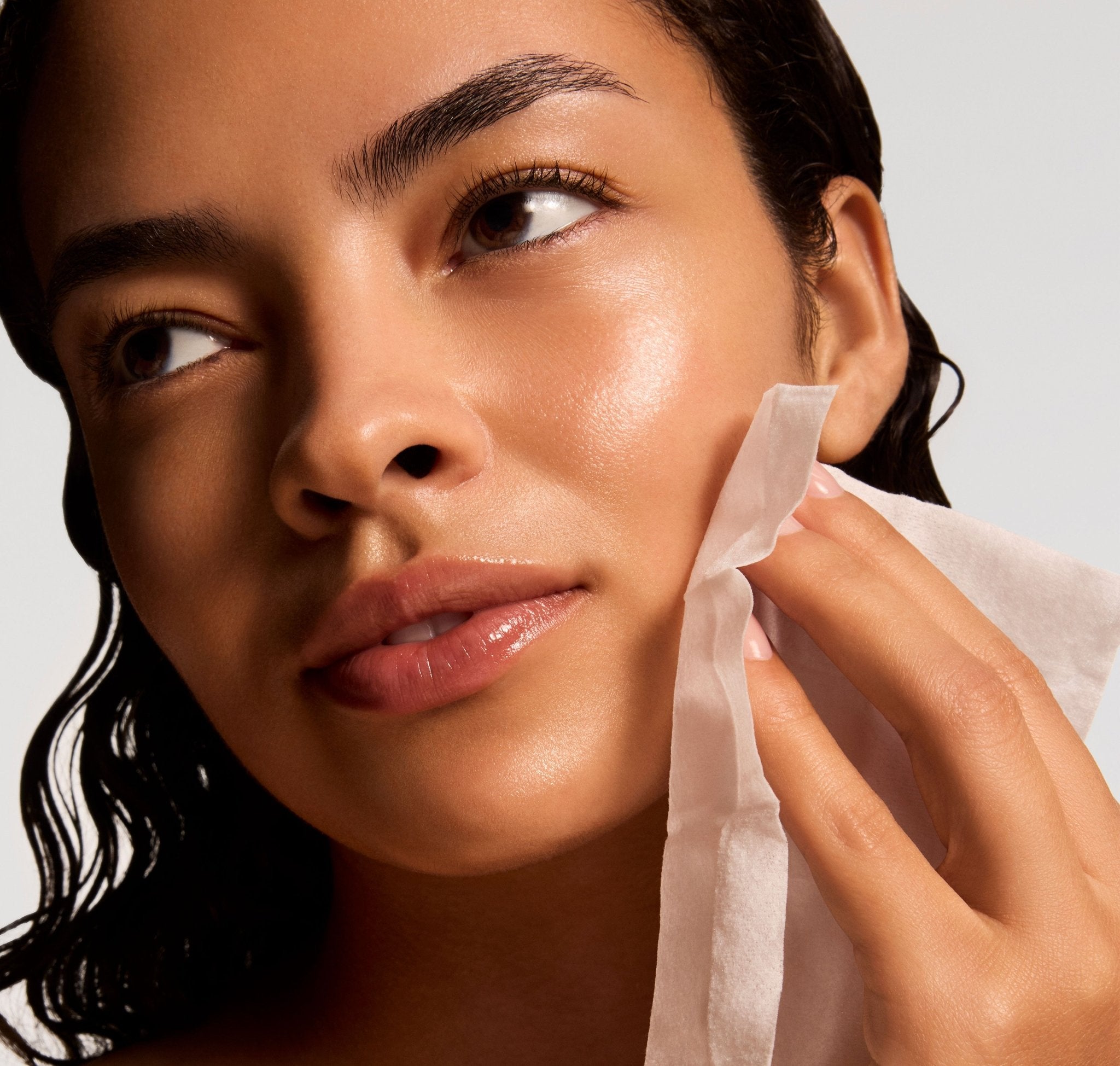iS Clinical Active Peel System, model using a towelette