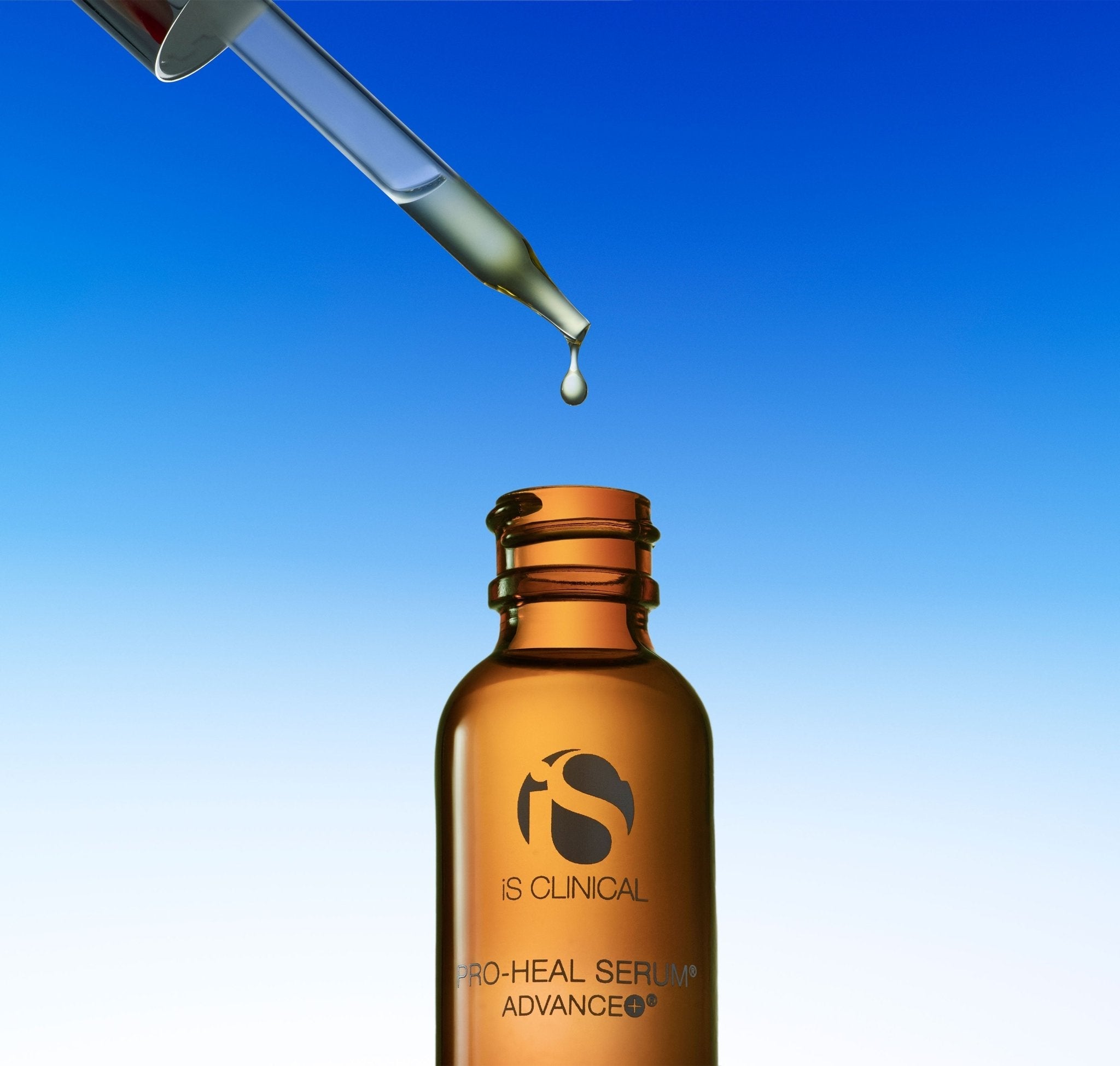 iS Clinical Pro-Heal Serum Advance+, bottle on blue background